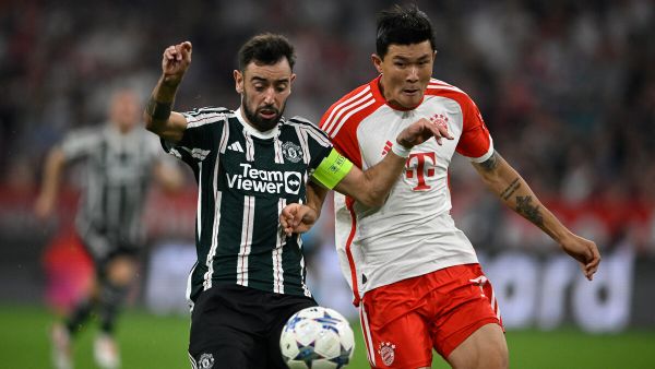 Manchester United's Portuguese midfielder #08 Bruno Fernandes (L) and Bayern Munich's South Korean defender #03 Kim Min-jae vie for the ball during the UEFA Champions League Group A football match FC Bayern Munich v Manchester United in Munich, southern Germany on September 20, 2023. (Photo by Tobias SCHWARZ / AFP)