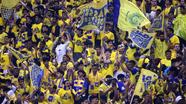 Supporters cheer in the stands during the Saudi Pro League football match between Al-Hilal and Al-Nassr at the King Fahd International Stadium in Riyadh on December 1, 2023. (Photo by Fayez NURELDINE / AFP)