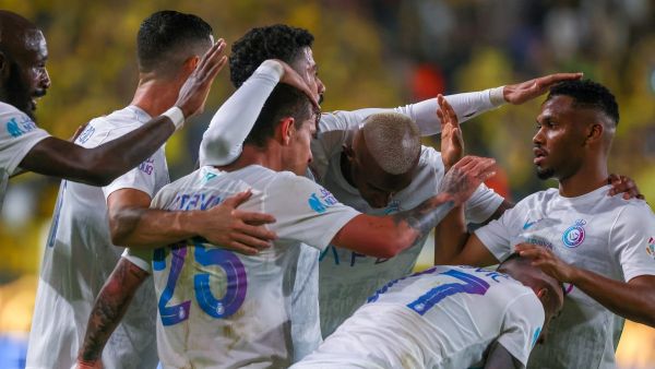 Nassr's Portuguese midfielder #25 Otavio (C) celebrates his goal with his team during the Saudi Pro League football match between Al-Nassr and Al-Riyadh at al-Awwal Park Stadium in Riyadh on December 8, 2023. (Photo by Fayez NURELDINE / AFP)