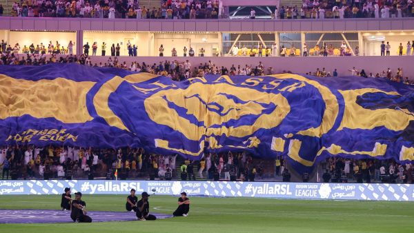 Al-Nassr fans cheer ahead of the Saudi Pro League football match between Al-Ittihad and Al-Nassr at King Abdullah Sports City Stadium in Jeddah on December 26, 2023. (Photo by AFP)