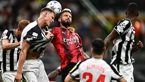 AC Milan's French forward #09 Olivier Giroud (C) jumps for the ball during the UEFA Champions League 1st round group F football match between AC Milan and Newcastle at the San Siro stadium in Milan on September 19, 2023. (Photo by GABRIEL BOUYS / AFP)