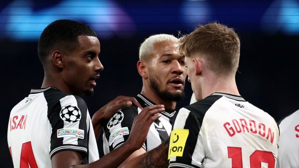 Newcastle United's Swedish striker #14 Alexander Isak (L) celebrates with teammates after opening the scoring during the UEFA Champions League 1st round, day 5, Group F football match between Paris Saint-Germain (PSG) and Newcastle United at the Parc des Princes stadium in Paris, on November 28, 2023. (Photo by FRANCK FIFE / AFP)