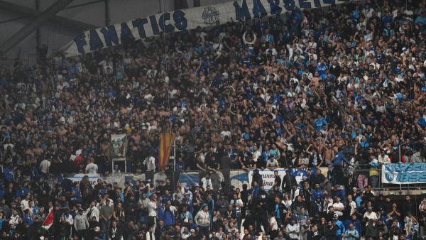 Marseille's supporters react at the Stade Velodrome in Marseille, southern France on October 29, 2023, after the French Ligue 1 football match between Marseille and Lyon was postponed after the Lyon's travelling team bus was attacked with stones as it entered the Stade Velodrome ahead of the match. Lyon former coach Fabio Grosso and his assistant were injured during the attack. (Photo by Christophe SIMON / AFP)