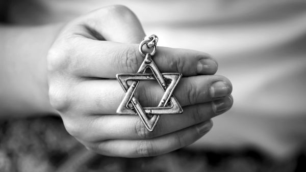 oung woman's hand holding a David Star