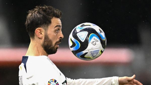 Portugal’s midfielder #10 Bernardo Silva chest controls the ball during the UEFA Euro 2024 Group J qualification football match between Liechtenstein and Portugal at the Rheinpark stadium in Vaduz, Liechtenstein, on November 16, 2023. (Photo by SEBASTIEN BOZON / AFP)