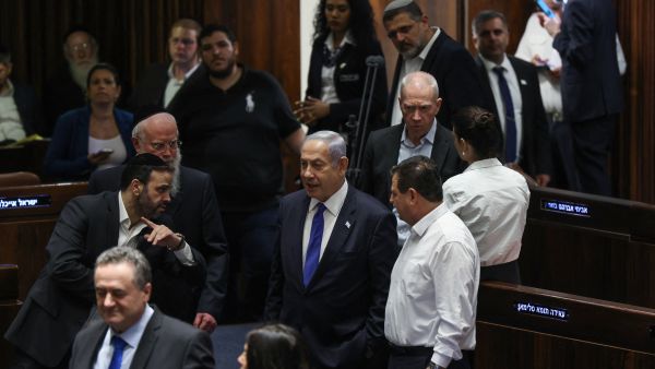 Israel's Prime Minister Benjamin Netanyahu (C) arrives for a session at the Knesset, the Israeli parliament, in Jerusalem on July 24, 2023, amid a months-long wave of protests against the government's planned judicial overhaul. (Photo by RONALDO SCHEMIDT / AFP) Netanyahu