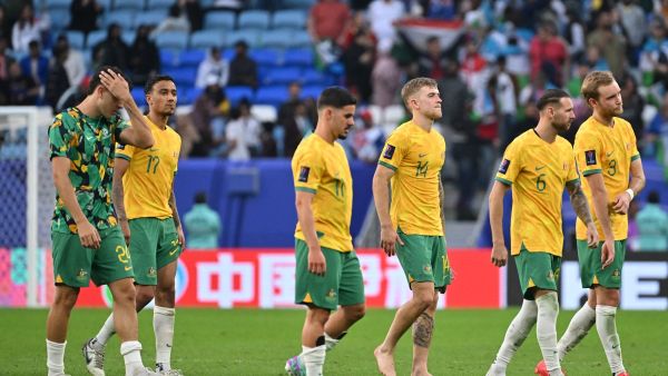 Australia's players leave the pitch after the Qatar 2023 AFC Asian Cup Group B football match between Australia and Uzbekistan at the Al-Janoub Stadium in Al-Wakrah, south of Doha on January 23, 2024. (Photo by HECTOR RETAMAL / AFP)