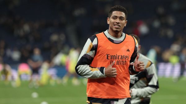 Real Madrid's English midfielder #5 Jude Bellingham warms up prior to the Spanish league football match between Real Madrid CF and Villarreal CF at the Santiago Bernabeu stadium in Madrid on December 17, 2023. (Photo by Thomas COEX / AFP)