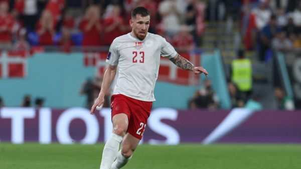 Denmark's midfielder #23 Pierre-Emile Hojbjerg runs with the ball during the Qatar 2022 World Cup Group D football match between France and Denmark at Stadium 974 in Doha on November 26, 2022. (Photo by Giuseppe CACACE / AFP)