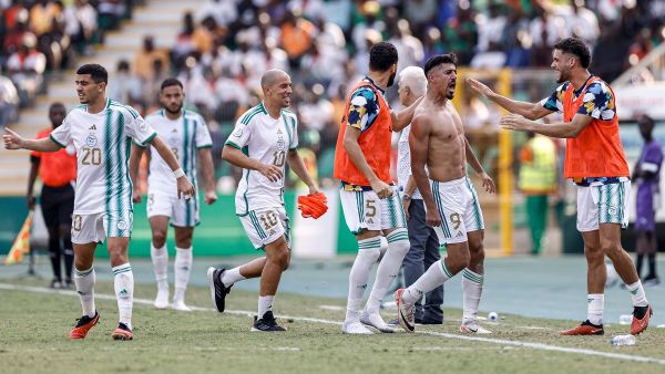 Algeria's forward #9 Baghdad Bounedjah (2R) celebrates with teammates after scoring his team's second goal during the Africa Cup of Nations (CAN) 2024 group D football match between Algeria and Burkina Faso at Stade de la Paix in Bouake on January 20, 2024. (Photo by KENZO TRIBOUILLARD / AFP)