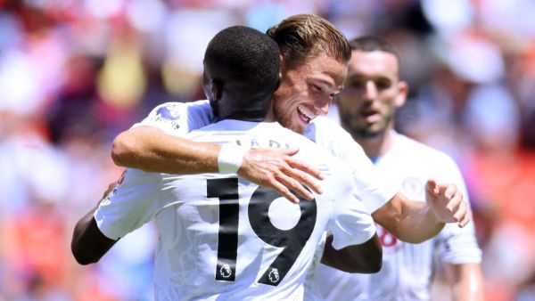 Matty Cash of Aston Villa celebrates with teammate Moussa Diaby after scoring the teams third goal during the Premier League Summer Series match between Aston Villa and Brentford FC at FedExField on July 30, 2023 in Landover, Maryland. Mike Stobe/Getty Images/AFP (Photo by Mike Stobe / GETTY IMAGES NORTH AMERICA / Getty Images via AFP)