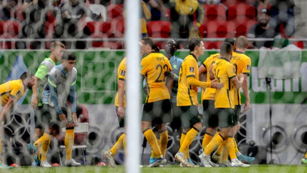 Australia's players celebrate after a goal during the FIFA World Cup 2022 play-off qualifier football match between UAE and Australia at Ahmad bin Ali stadium in Qatar's Ar-Rayyan city on June 7, 2022. (Photo by Mustafa ABUMUNES / AFP)