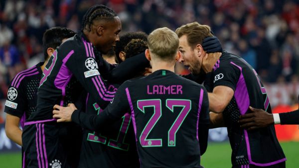 Bayern Munich's English forward #09 Harry Kane (R) celebrates scoring the opening goal with his teammates during the UEFA Champions League Group A football match between FC Bayern Munich and Galatasaray AS in Munich, southern Germany on November 8, 2023. (Photo by MICHAELA REHLE / AFP)