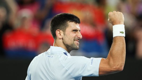 Serbia's Novak Djokovic celebrates after victory against France's Adrian Mannarino during their men's singles match on day eight of the Australian Open tennis tournament in Melbourne on January 21, 2024. (Photo by Martin KEEP / AFP)