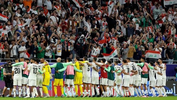 Iraq's players greet their fans at the end of the Qatar 2023 AFC Asian Cup Group D football match between Indonesia and Iraq at the Ahmad bin Ali Stadium in Al-Rayyan, west of Doha on January 15, 2024. (Photo by KARIM JAAFAR / AFP)