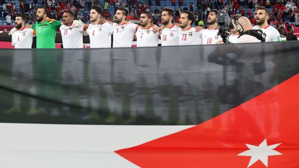 Jordan's players chant the national anthem ahead of FIFA Arab Cup 2021 quarter final football match between Egypt and Jordan at the Al-Janoub Stadium in the Qatari city of Al-Wakrah on December 11, 2021. (Photo by KARIM JAAFAR / AFP)