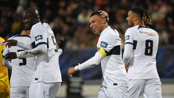 Paris Saint-Germain's French forward #07 Kylian Mbappe (C) celebrates with teammates after scoring his team's fourth goal during the French Cup football match between US Revel and Paris Saint-Germain at the Pierre-Fabre stadium in Castres, southern France, on January 7, 2024. (Photo by Valentine CHAPUIS / AFP)
