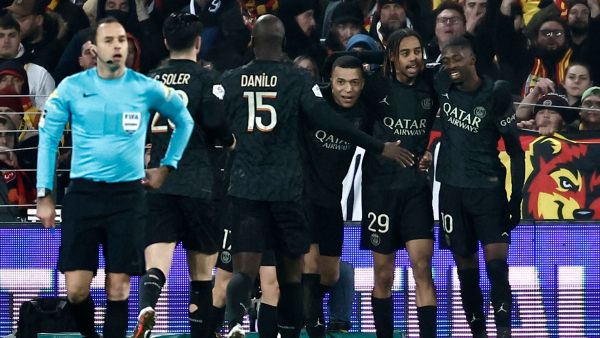 Paris Saint-Germain's French forward #29 Bradley Barcola (2nd R) celebrates with teammates after scoring his team's first goal during the French L1 football match between RC Lens and Paris Saint-Germain (PSG) at Stade Bollaert-Delelis in Lens, northern France on January 14, 2024. (Photo by Sameer Al-Doumy / AFP)