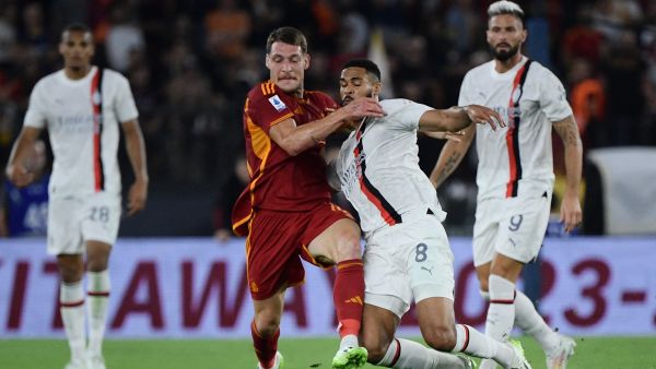 Roma's Italian forward #11 Andrea Belotti (L) fights for the ball with AC Milan's English midfielder #08 Ruben Loftus-Cheek during the Italian Serie A football match between AS Roma and AC Milan at the Olympic stadium in Rome on September 1, 2023. (Photo by Filippo MONTEFORTE / AFP)