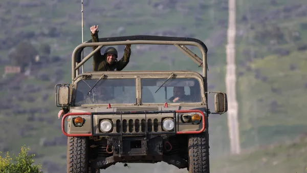 An Israeli military vehicle makes its way through the Israeli-annexed Golan Heights near the border with Lebanon, on February 27, 2024,