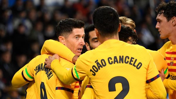 Barcelona's Polish forward #09 Robert Lewandowski celebrates scoring the opening goal during the Spanish league football match between Deportivo Alaves and FC Barcelona at the Mendizorroza stadium in Vitoria on February 3, 2024. (Photo by Ander Gillenea / AFP)