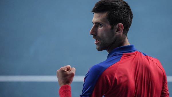 Serbia's Novak Djokovic celebrates a point against Spain's Pablo Carreno Busta during their Tokyo 2020 Olympic Games men's singles tennis match for the bronze medal at the Ariake Tennis Park in Tokyo on July 31, 2021. (Photo by Tiziana FABI / AFP)