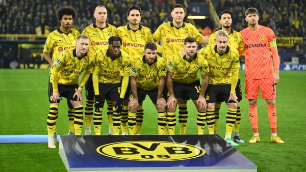 BVB Borussia Dortmund's players line up prior to the start of the UEFA Champions League group F football match between BVB Borussia Dortmund and Paris Saint-Germain in Dortmund, western Germany, on December 13, 2023. (Photo by INA FASSBENDER / AFP)