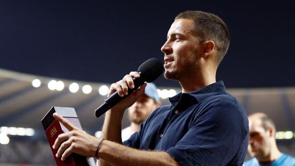 Former Red Devils captain Eden Hazard speaks as he celebrates the end of his career with the Belgian national team Red Devils, during a ceremony after the UEFA Euro 2024 group F qualification football match between Belgium and Austria at the King Baudouin Stadium in Brussels, on June 17, 2023. (Photo by Kenzo TRIBOUILLARD / AFP)