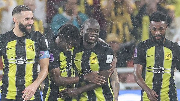 Ittihad's French forward #09 Karim Benzema (L) and Ittihad's French midfielder #07 N'Golo Kante (C) celebrate after a goal during the FIFA Club World Cup first round football match between Al-Ittihad and Auckland City at the King Abdullah Sports City stadium in Jeddah, on December 12, 2023. Al Ittihad secured progress from the first round of the Club World Cup with a convincing 3-0 win against Auckland City. (Photo by AFP)