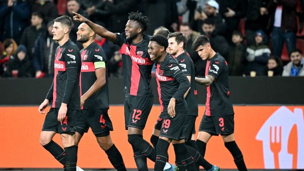 Bayer Leverkusen's Burkinabe defender #12 Edmond Tapsoba (3rd L) celebrates with Bayer Leverkusen's English midfielder #19 Nathan Tella (4th L) and other teammates after scoring the 2-0 goal during the UEFA Europa League Group H football match between Bayer 04 Leverkusen and Molde FK in Leverkusen, on December 14, 2023. (Photo by ULRICH HUFNAGEL / AFP)