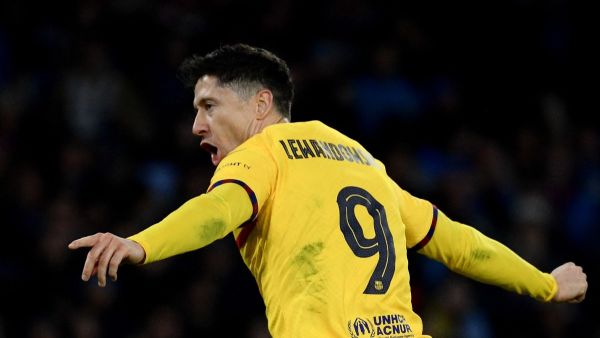 Barcelona's Polish forward #09 Robert Lewandowski celebrates after scoring a goal during the UEFA Champions League round of 16 first Leg football match between Napoli and Barcelona at the Diego-Armando-Maradona stadium in Naples on February 21, 2024. (Photo by Filippo MONTEFORTE / AFP)