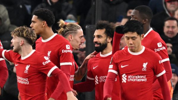 Liverpool's Egyptian striker #11 Mohamed Salah (C) celebrates with teammates after scoring their third goal during the UEFA Europa League group E football match between Liverpool and Linzer ASK at Anfield in Liverpool, north west England on November 30, 2023. (Photo by Oli SCARFF / AFP)