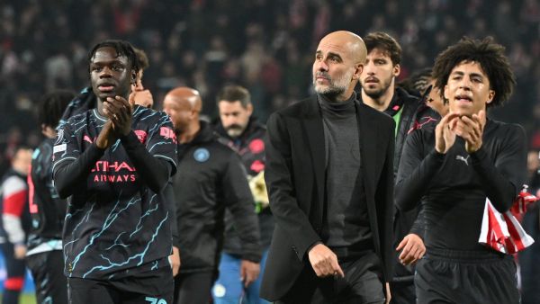 Manchester City's Spanish manager Pep Guardiola (C) and Manchester City players celebrate after winning the UEFA Champions League Group G day 6 group stage football match between Crvena Zvezda (Red Star Belgrade) and Manchester City at the Red Star stadium in Belgrade, on December 13, 2023. (Photo by ANDREJ ISAKOVIC / AFP)