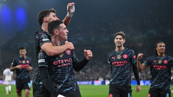 Manchester City's English midfielder #47 Phil Foden celebrates with Manchester City's Portuguese defender #03 Ruben Dias scoring during the UEFA Champions League round of 16, first-leg football match between FC Copenhagen and Manchester City in Copenhagen, Denmark, on February 13, 2024. (Photo by Jonathan NACKSTRAND / AFP)