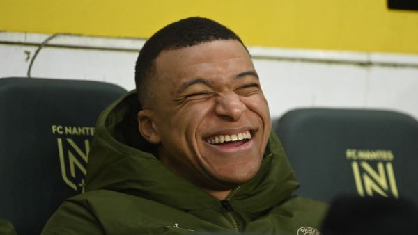 Paris Saint-Germain's French forward #07 Kylian Mbappe smiles prior to the French L1 football match between FC Nantes and Paris Saint-Germain (PSG) at the La Beaujoire stadium in Nantes, western France, on February 17, 2024. (Photo by Sebastien SALOM-GOMIS / AFP)