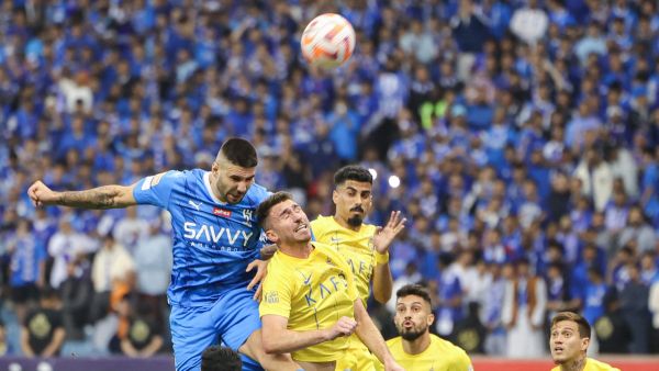 Hilal's Serbian forward #09 Aleksandar Mitrovic (L) heads the ball next to Nassr's French defender #27 Aymeric Laporte (2L) during the Saudi Pro League football match between Al-Hilal and Al-Nassr at the King Fahd International Stadium in Riyadh on December 1, 2023. (Photo by Fayez NURELDINE / AFP)