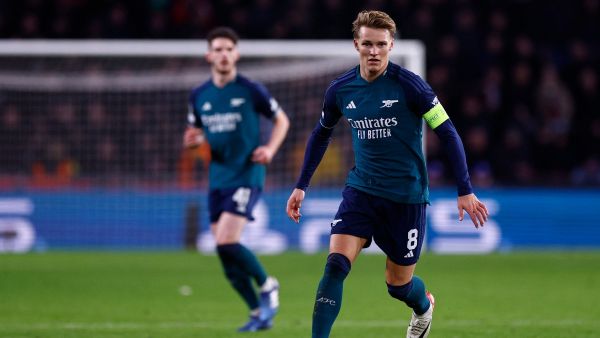 Arsenal's Norwegian midfielder #08 Martin Odegaard controls the ball during a UEFA Champions League group B football match between PSV Eindhoven and Arsenal FC at the Philips Stadium in Eindhoven, on December 12, 2023. (Photo by KENZO TRIBOUILLARD / AFP)