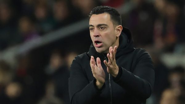 Barcelona's Spanish coach Xavi claps during the Spanish league football match between FC Barcelona and CA Osasuna at the Estadi Olimpic Lluis Companys in Barcelona on January 31, 2024. (Photo by LLUIS GENE / AFP)