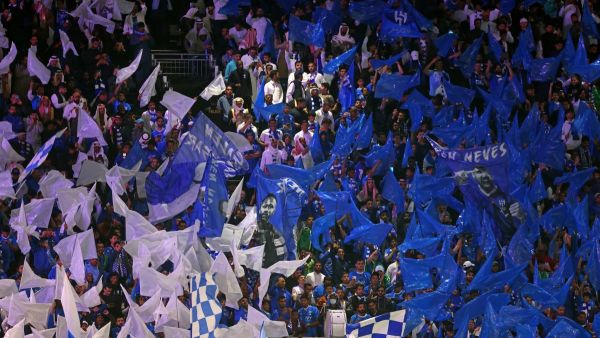 Hilal's supporters cheer after their team's first goal during the AFC Champions League football match between Saudi Arabia's Al-Hilal SFC and Iran’s Sepahan FC at the Kingdom Arena Stadium in Riyadh on February 22, 2024. (Photo by Fayez NURELDINE / AFP)