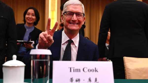 Tim Cook in China to open second largest Apple store and revive iPhone sales