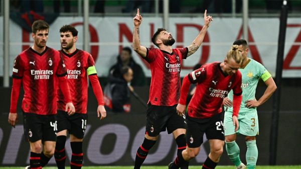 AC Milan's French forward #09 Olivier Giroud (3th R) celebrates after scoring his team's first goal during the UEFA Europa League match, Round of 16, 1st leg, between AC Milan and SK Slavia Prague at the San Siro Stadium in Milan on March 7, 2024. (Photo by GABRIEL BOUYS / AFP)