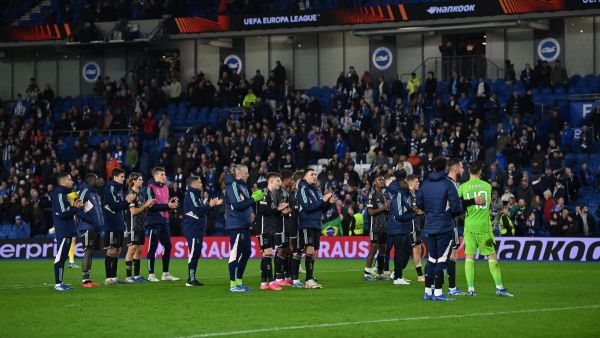 Ajax players applaud their fans after the UEFA Europa League Group B football match between Brighton and Hove Albion and Ajax at the American Express Community Stadium in Brighton, southern England on October 26, 2023. Brighton won the match 2-0. (Photo by Glyn KIRK / AFP)