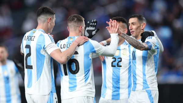 Argentina's midfielder #16 Giovani Lo Celso (2nd L) celebrates with teammates after scoring a goal during the international friendly football match between El Salvador and Argentina at Lincoln Financial Field in Philadelphia, Pennsylvania, on March 22, 2024. (Photo by Charly TRIBALLEAU / AFP)