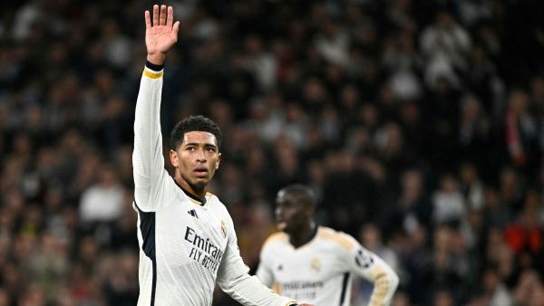 Real Madrid's English midfielder #5 Jude Bellingham waves during the UEFA Champions League last 16 second leg football match between Real Madrid CF and RB Leipzig at the Santiago Bernabeu stadium in Madrid on March 6, 2024. (Photo by JAVIER SORIANO / AFP)