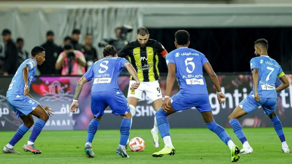 Ittihad's French forward #09 Karim Benzema is marked by Hilal's Saudi midfielder #28 Mohamed Kanno, Portuguese midfielder #08 Ruben Neves, Saudi defender #05 Ali al-Bulaihi, and Saudi midfielder #07 Salman Al-Faraj during the Saudi Pro League football match between Al-Ittihad and Al-Hilal at Prince Abdullah al-Faisal Stadium in Jeddah on September 1, 2023. (Photo by AFP)