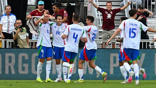 Italy's forward #09 Mateo Retegui (L) celebrates scoring his team's first goal with teammates during the international friendly football match between Venezuela and Italy at Chase Stadium in Fort Lauderdale, Florida, March 21, 2024. (Photo by CHANDAN KHANNA / AFP)