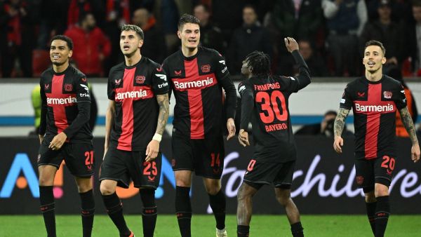 Bayer Leverkusen's Czech forward #14 Patrik Schick (C) celebrates scoring the 3-2 goal with team mates during the UEFA Europa League Group round of 16, second-leg football match between Bayer 04 Leverkusen and Garabagh in Leverkusen, western Germany on March 14, 2024. (Photo by INA FASSBENDER / AFP)