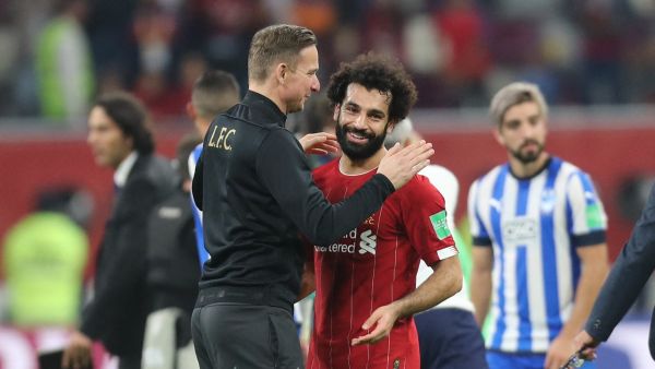 Liverpool's Dutch assistant manager Pepijn Lijnders (L) speaks with Liverpool's Egyptian midfielder Mohamed Salah following the 2019 FIFA Club World Cup semi-final football match between Mexico's Monterrey and England's Liverpool at the Khalifa International Stadium in the Qatari capital Doha on December 18, 2019. Liverpool will face Flamengo in the Final of the FIFA Club World Cup on December 21. / AFP / KARIM JAAFAR