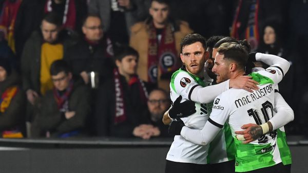 Liverpool's Uruguayan striker #09 Darwin Nunez (hidden) celebrates after scoring a goal with team mates during the UEFA Europa League round of 16 first leg football match between AC Sparta Praha and Liverpool FC in Prague on March 7, 2024. (Photo by MICHAL CIZEK / AFP)