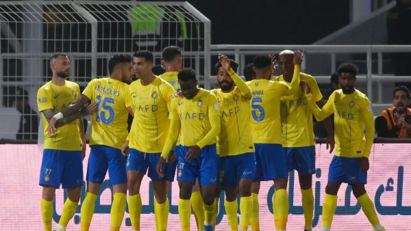 Nassr's players celebrate their team's third goal during the Saudi Pro League football match between Al-Shabab and Al-Nassr at the Al-Shabab Club Stadium in Riyadh on February 25, 2024. (Photo by Fayez NURELDINE / AFP)